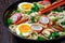 Udon noodle soup in a bowl, top view, close-up