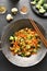 Udon stir-fry noodles with vegetables in wok