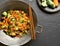 Udon stir-fry noodles with vegetables in wok