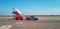 Udonthani International Airport , Thailand - November 7 , 2017 :Baggage trailer truck is waiting for an airplane to load baggages.