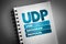 UDP - User Datagram Protocol acronym on notepad, technology concept background