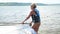 Ufa, Russia, June, 13, 2021, senior woman life jacket with windsurfing