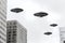 UFO, an alien saucer hovering above the clouds, hovering motionless in the sky. AI generation