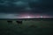 UFO, alien spacecraft hovered over the field and farm. realistic illustration