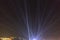 UFO with light rays landing in a city