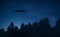 Ufo in night forest