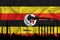 Uganda flag, background with space for your logo - industrial 3D illustration.Silhouette of a chemical plant, oil refining, gas,