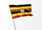 Uganda flag flying high in the isolated background Uganda independence day. World national flag collection