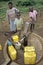 Ugandan Children fetch water at water pump