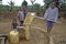 Ugandan Children fetch water at water pump