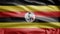 Ugandan flag waving in the wind. Close up of Uganda banner blowing soft silk