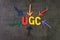 UGC, User generated content using in brand communication online advertising concept, multi color arrows pointing to the word UGC