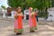 UGLICH, RUSSIA. The female folklore duet in the Russian national suits sings the song on the street