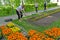 UGLICH, RUSSIA. The female gardener loosens the soil for planting of flower seedling in the city square