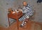 UGLICH, RUSSIA. The prisoner sits at a table in the camera. Museum of prison art. Yaroslavl region