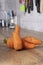 Ugly Carrot in the kitchen worktop, blurred background. Soft focus
