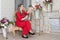 Ugly domineering woman is posing in red dress