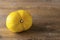 Ugly double organic lemon unusual shape on wooden textured surface with knife. Buying imperfect product to reduce food
