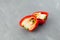 Ugly double pepper  cut into two halves. Inside fruit grows in shape of heart. Selective focus. Fun vegetable concept for