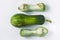 Ugly food concept. Unusual shaped zucchini with mold, scar-like structure, scratches. Top view