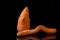 Ugly food. Deformed organic carrots on the black background