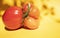 An ugly fresh tomato on a yellow background with space for text. Banner