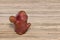 Ugly funny potato on a wooden background with copy space. Concept - Unusual vegetables and fruits. Reduce amount of plant or food
