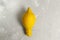 Ugly lemon on a gray background. Copy space.