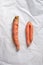 Ugly misshapen carrots on craft paper background. Concept of zero waste production. Top view. Copy space. Non gmo vegetables