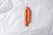 Ugly misshapen carrots on craft paper background. Concept of zero waste production. Top view. Copy space. Non gmo vegetables