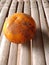 An ugly orange fruit on the bamboo table.