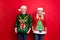 Ugly pullover party concept. Two cheerful friendly excited positive elderly grey white haired grandmother grandfather in