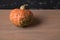 Ugly pumpkin with warts on a dark background.