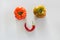 Ugly ripe tomatoes and pepper as face, smile with eyes