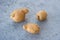 Ugly vegetables, deformed fresh potatoes on a gray concrete background, selective focus