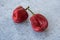 Ugly vegetables, deformed fresh red paprika on a gray concrete background, selective focus