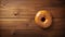 Uhd Image Of Donut On Wood Table: Subtle Luminosity And 8k Resolution