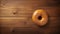 Uhd Image Of A Donut On Wooden Table - Top View