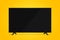 uhd smart tv on yellow background