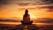 Uhd Stock Photo: Woman Meditating On Beach At Sunset