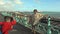 UK, Brighton. UK, Brighton. Young happy couple taking photo on the coast. Happy lovers, woman and man traveling on