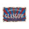 UK cities retro greetings from Glasgow Vintage sign. Travel destinations theme on old rusty background.