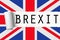 Uk england great britain flag with word brexit on ripped torn paper