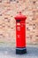 UK Ironbridge March 3 2016 A traditional bright red cast iron British Victorian post or mail box