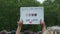 UK, London, 3/6/20 - A mixed race female holding a Black Lives Matter One Love banner at an anti racism protest in London