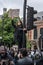 UK, London, 6/6/2020 - A Black Lives Matter protester who`s climbed on a traffic light to wave an anti-racism placard