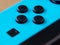 UK, March 2020: Close up of blue neon joy con controller Nintendo Switch