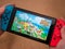 UK, March 2020: Nintendo Switch games console hand held animal crossing new horizons