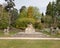 UK  Norfolk  Sandringham Estate  2019  April  23: Sandringham Esatate Gardens  Buddha Statue and Attending Lion in the grounds of