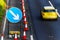 UK Road Services Roadworks Cones and directional Signs on motorway with yellow car passing